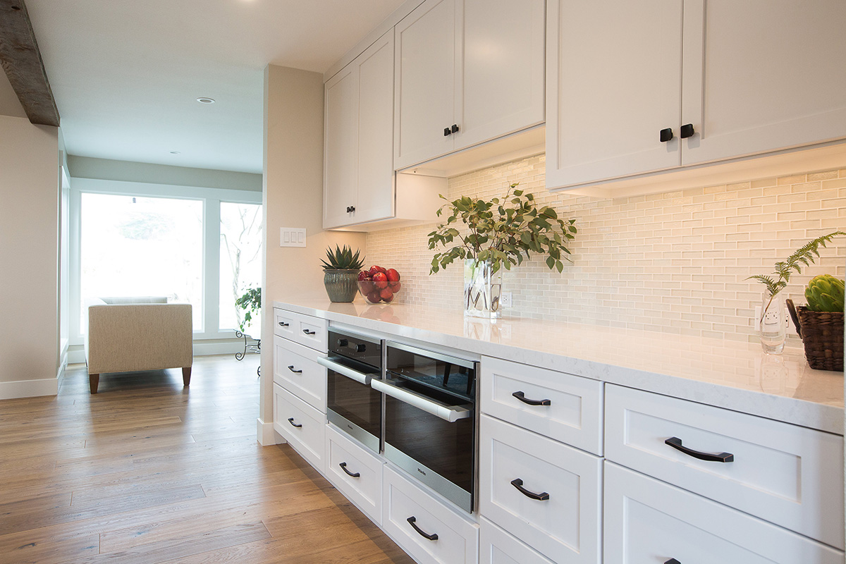 rustic-contemporary-home-white-cabinets-white-countertop-white-tile-backsplash
