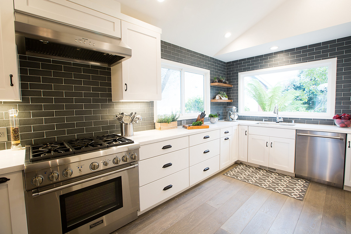 modern-industrial-kitchen-counter-stove-sink-tile-backsplash